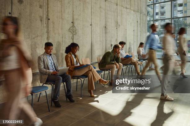 group of business people waiting for job interview in the office. - entrevista imagens e fotografias de stock