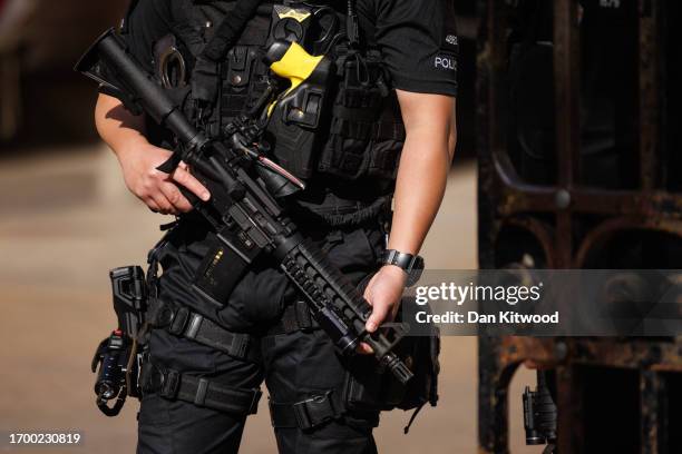 An armed police officer in central Westminster on September 25, 2023 in London, England. It has been reported that more than 100 officers have turned...