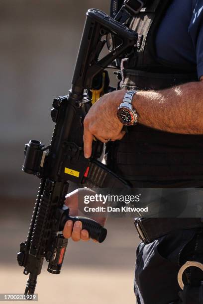 An armed police officer in central Westminster on September 25, 2023 in London, England. It has been reported that more than 100 officers have turned...