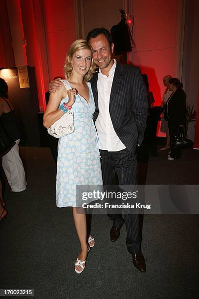 Tanja Buelter and friend Moritz Quiske On screen during summer festival in the Axel Springer publishing house in Berlin 060706.