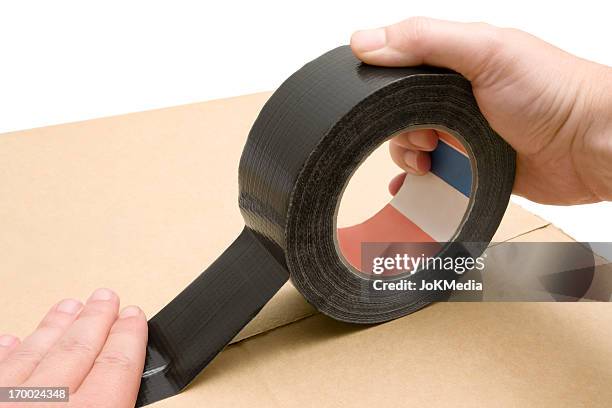 usando cinta para conductos - bolsita fotografías e imágenes de stock