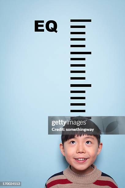 boy measuring emotional intelligence - emotional intelligence stock pictures, royalty-free photos & images