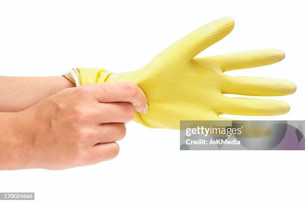 putting washing up gloves on - white glove cleaning stock pictures, royalty-free photos & images