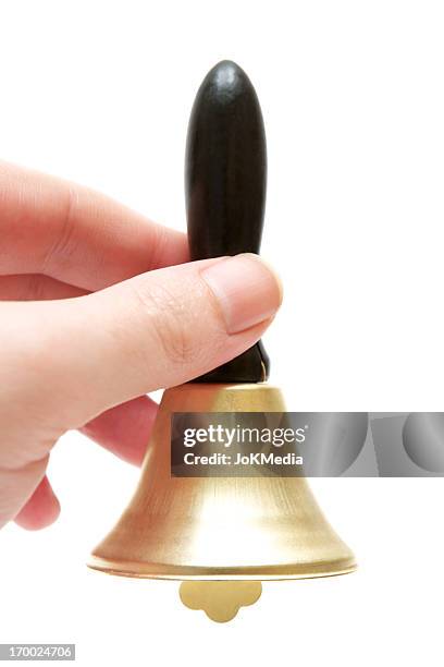 ringing an old handbell - handbell stock pictures, royalty-free photos & images