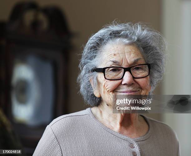sad smile senior woman - granny stock pictures, royalty-free photos & images