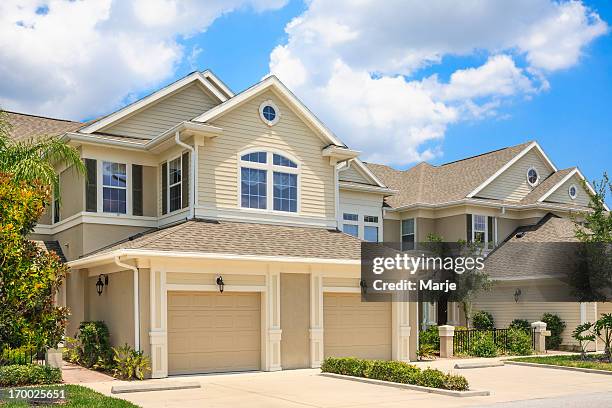 cream colored house in a suburban neighborhood - semi detached house stock pictures, royalty-free photos & images