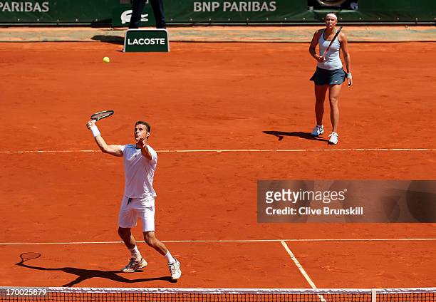 Frantisek Cermak of Czech Republic plays a forehand next to team-mate Lucie Hradecka in their mixed doubles final against Kristina Mladenovic of...