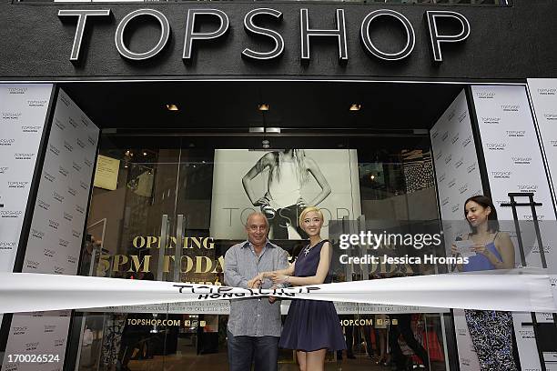 Sir Philip Green the owner of Topshop and Taiwanese actress Gwei Lun Mei cut a ribbon to mark the opening of the new Topshop store as TV host Mandy...