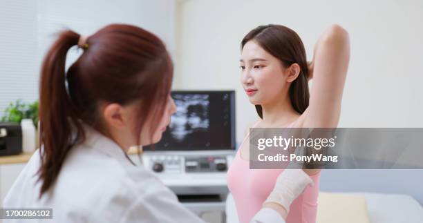 woman lymph armpit examination - oksel stockfoto's en -beelden