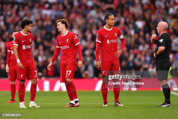 Referee Simon Hooper cancels his yellow card for Curtis Jones of Liverpool before upgrading the card to red during the Premier League match between...