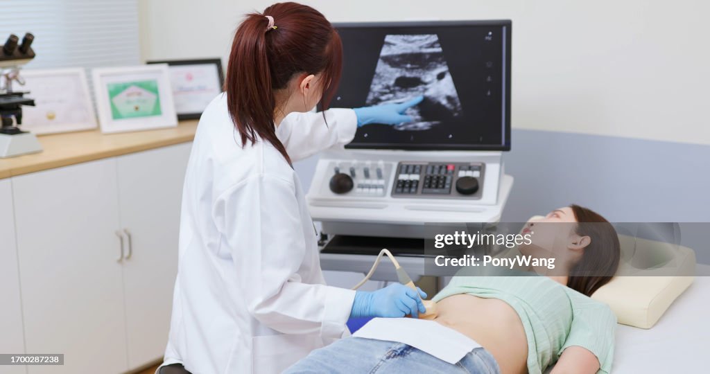 Woman belly ultrasound examination