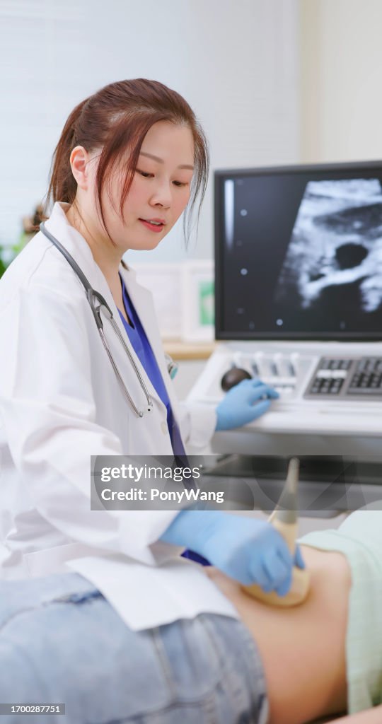 Woman belly ultrasound examination