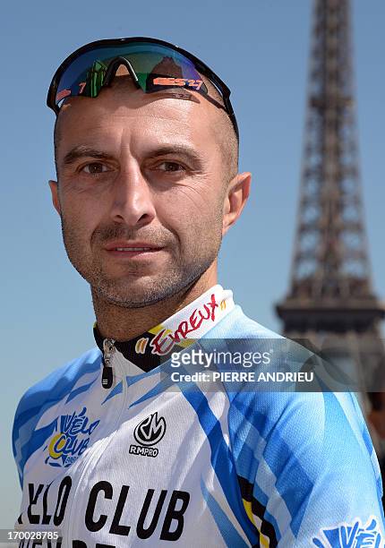 French cyclist Pierre-Michael Micaletti poses on June 5, 2013 in front of the Eiffel tower in Paris. While some cycle the Paris-Nice route in seven...