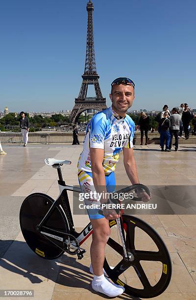 French cyclist Pierre-Michael Micaletti poses on June 5, 2013 in front of the Eiffel tower in Paris. While some cycle the Paris-Nice route in seven...