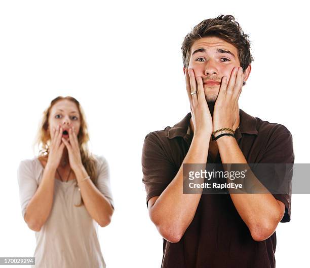 young couple very upset by something just seen or heard - witness stock pictures, royalty-free photos & images