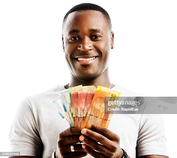 happily smiling man holding mixed new south african "mandela" banknotes - holding aloft stock pictures, royalty-free photos & images