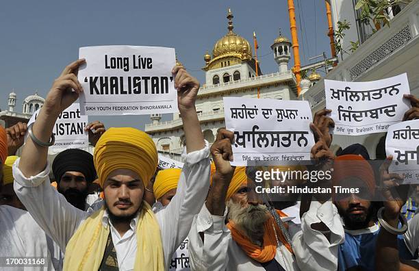 The Sikhs supporters of Khalistan with placards protest outside the Akal Takht Sahib on 29th Anniversary of Operation Blue Star on June 6, 2013 in...