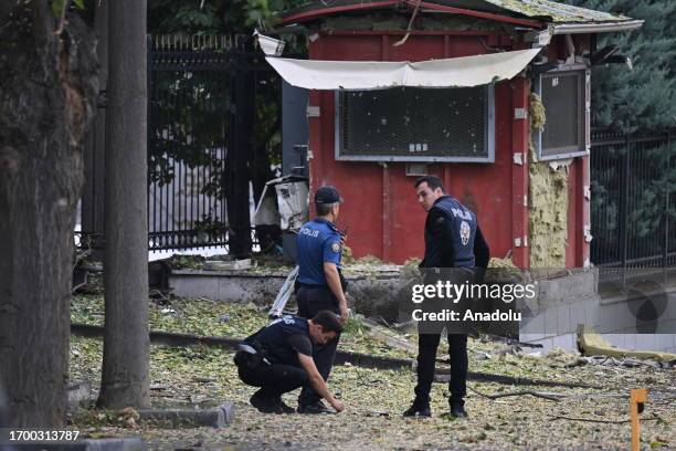 Police officers inspect area after an explosion near the Turkish Parliament and Interior Ministry in Ankara, Turkiye on October 01, 2023. 2...