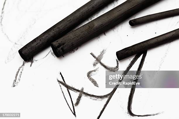 sticks of charcoal write art on white sketchpad - drawing charcoal stockfoto's en -beelden