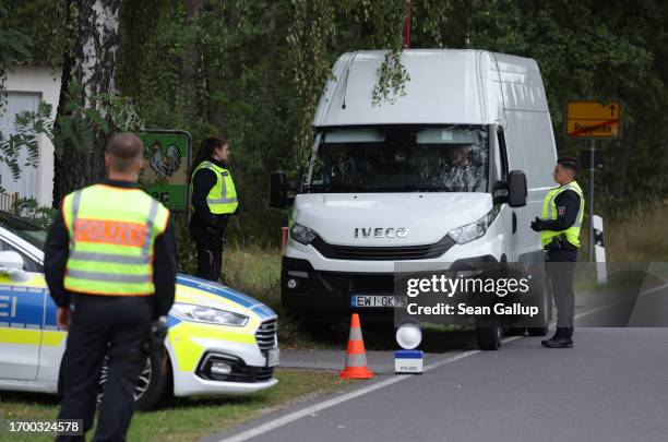 Police searching for illegal immigrants stop a van at a checkpoint not far from the Polish border on September 25, 2023 near Cottbus, Germany....