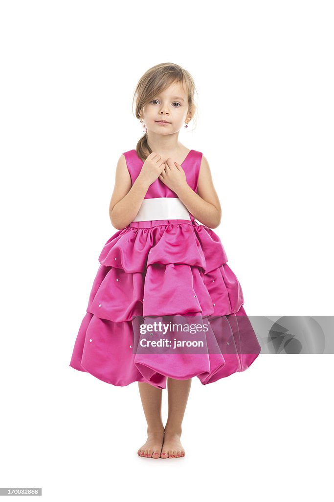 Portrait of small girl in pink dress