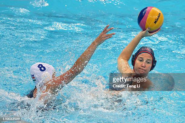 Kelly Rulon of the United States challenges with Keszthelyi Rita of Hungary during the match between the United States and Hungary on the sixth day...