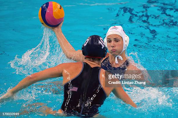 Bujka Barbara of Hungary challenges Kelly Rulon of United States during the Women's Water Polo Gold Medal match between the United States and Hungary...