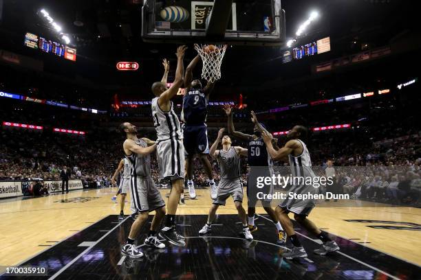 Tony Allen of the Memphis Grizzlies drives for a shot attempt against the Tim Duncan of the San Antonio Spurs during Game Two of the Western...