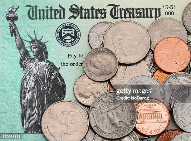 us coins on irs tax refund check - tiocentsmynt bildbanksfoton och bilder