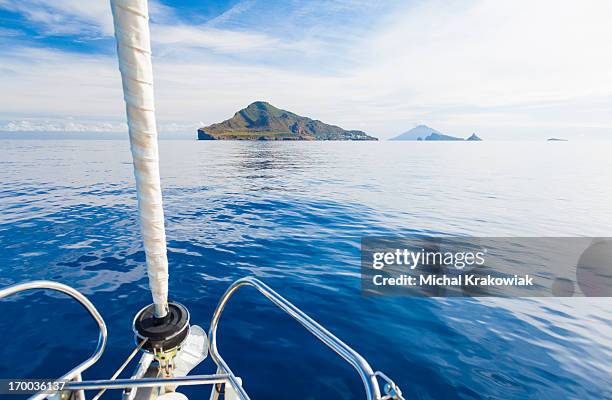 eaolian islands ahead of yacht - aeolian islands stock pictures, royalty-free photos & images