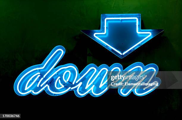 classic americana neon blue down sign and arrow - neon sign arrow stockfoto's en -beelden