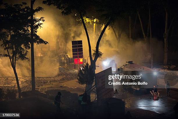 Protestors fight Istanbul police to reach the Prime Minister's building June 2, 2013 in Istanbul, Turkey. People started peacefully protesting the...