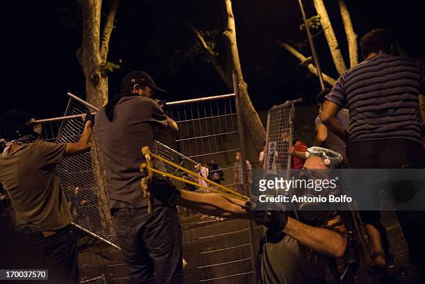 Protestors fight Istanbul police to reach the Prime Minister's building June 2, 2013 in Istanbul, Turkey. People started peacefully protesting the...