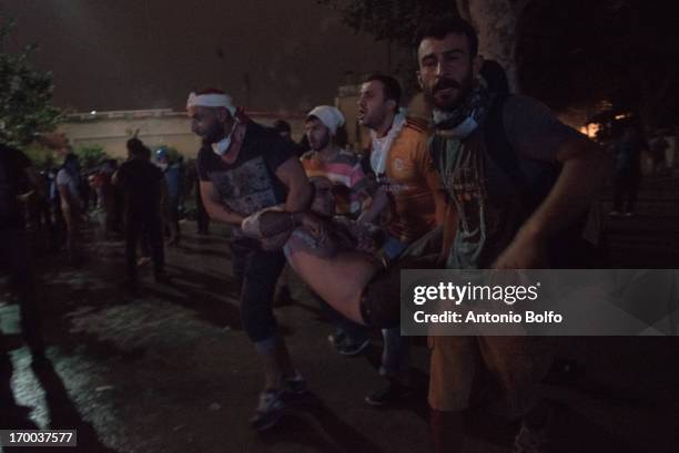 Protestors fight Istanbul police to reach the Prime Minister's building June 2, 2013 in Istanbul, Turkey. People started peacefully protesting the...