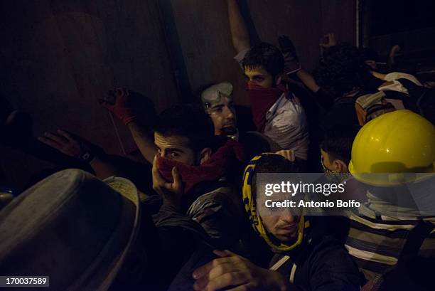 Protestors fight Istanbul police to reach the Prime Minister's building June 2, 2013 in Istanbul, Turkey. People started peacefully protesting the...