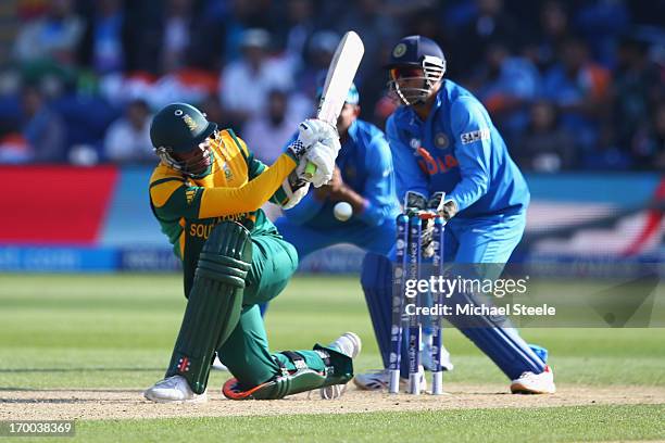 Lonwabo Tsotsobe of South Africa is bowled by Ravindra Jadeja as MS Dhoni looks on behind the stumps during the Group B ICC Champions Trophy match...