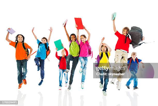 school children with backpacks and books jumping. - backpack isolated stock pictures, royalty-free photos & images