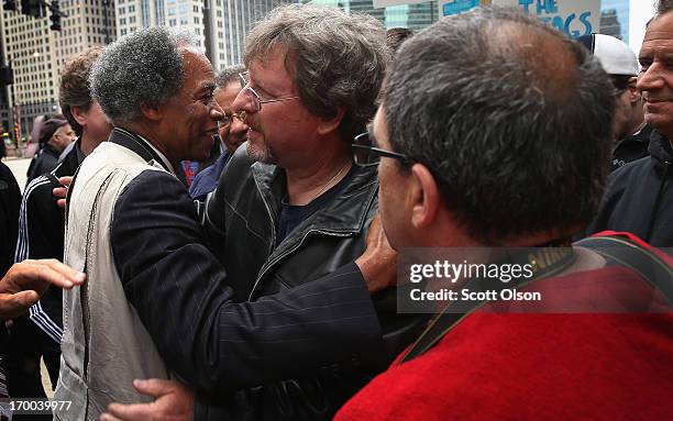 Former Chicago Sun-Times photographers Pulitzer Prize winner John White Tom Cruze , and Scott Stewart greet each other during a demonstration outside...