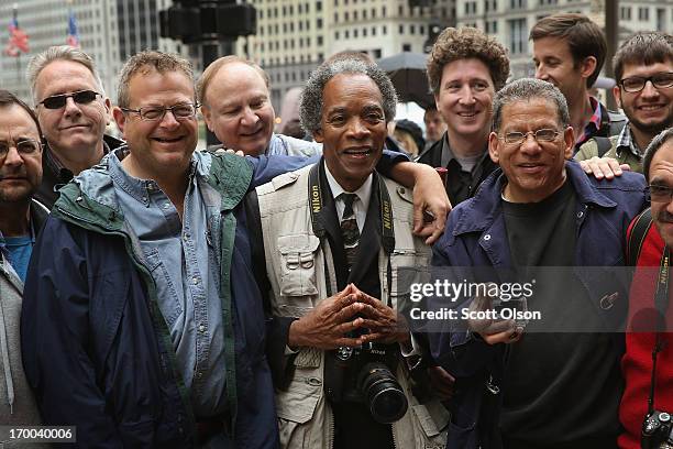 Former Chicago Sun-Times photographers pose for a picture following a demonstration outside the offices of the Sun-Times on June 6, 2013 in Chicago,...