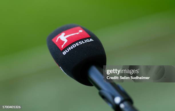 A detailed view of a microphone with the official Bundesliga logo is pictured prior to the Bundesliga match between VfL Wolfsburg and Eintracht...