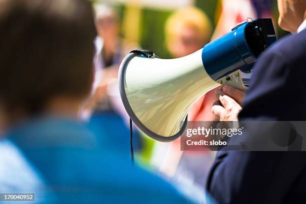 protest - protestor megaphone stock pictures, royalty-free photos & images