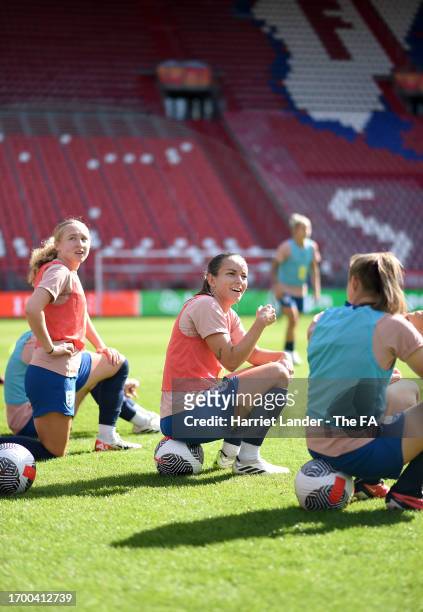Katie Robinson, Lucy Staniforth and Georgia Stanway of England look on during a training session at Stadium Galgenwaard on September 25, 2023 in...