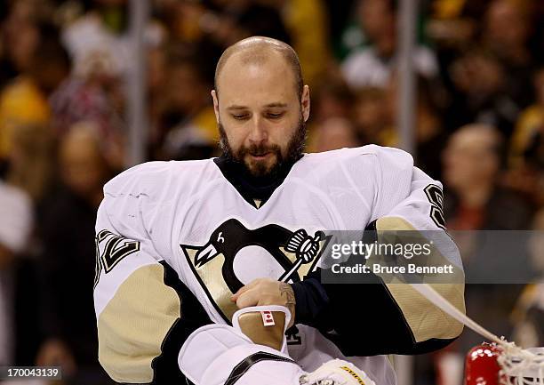 Tomas Vokoun of the Pittsburgh Penguins fixes his glove against the Boston Bruins during Game Three of the Eastern Conference Final of the 2013 NHL...