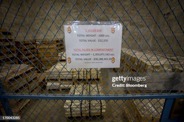 Silver bars sit in a vault at the United States Mint at West Point in West Point, New York, U.S., on Wednesday, June 5, 2013. Sales of gold and...