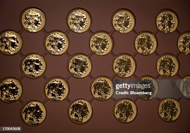 American Buffalo gold bullion coins sit in a tray at the United States Mint at West Point in West Point, New York, U.S., on Wednesday, June 5, 2013....