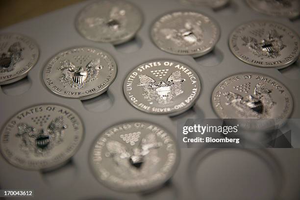 One-ounce silver Liberty coins sit in a tray at the United States Mint at West Point in West Point, New York, U.S., on Wednesday, June 5, 2013. Sales...