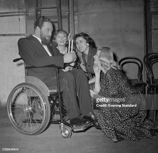Actors Michael Flanders , Tundy Nosztrai, Judith Jackson and Carol-Ann Aylett during a performance of the 'At The Drop Of A Hat' musical revue,...