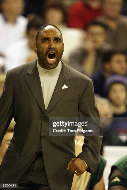 Coach Dru Joyce of St. Vincent-St. Mary High School yells from the bench during the game against Oak Hill Academy at the Cleveland State University...