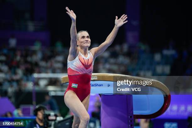 Oksana Chusovitina of Team Uzbekistan thanks the spectators in the Artistic Gymnastics - Women's Vault Final on day two of the 19th Asian Games at...