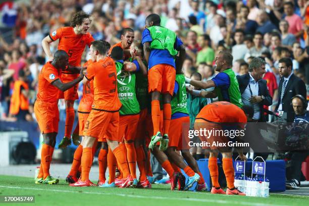 Georginio Wijnaldum of Netherlands celebrates his team's second goal with team mates during the UEFA European Under 21 Championship match between...